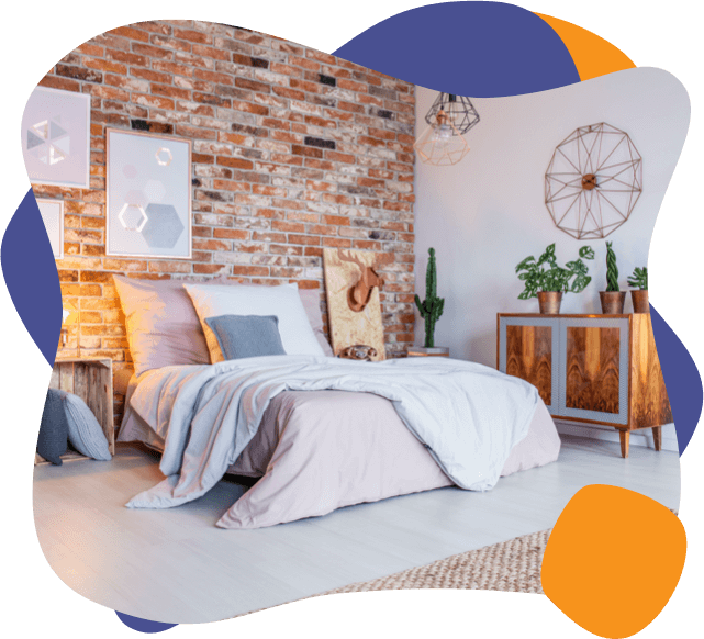 a unique bedroom with a brick wall and a cactus by the bed